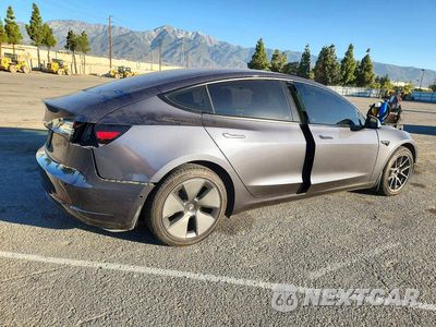 Trzecie zdjęcie samochodu z tyłu: 2022 TESLA MODEL 3 VIN:5YJ3E1EA4NF114341 - miniatura