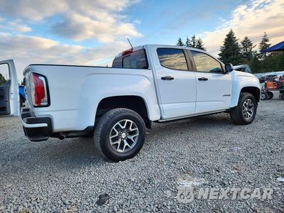 Trzecie zdjęcie samochodu z tyłu: 2021 GMC CANYON AT4 VIN:1GTG6FEN5M1273424 - miniatura