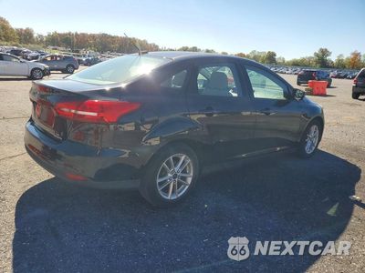 Trzecie zdjęcie samochodu z tyłu: 2016 FORD FOCUS SE VIN:1FADP3F24GL261931 - miniatura
