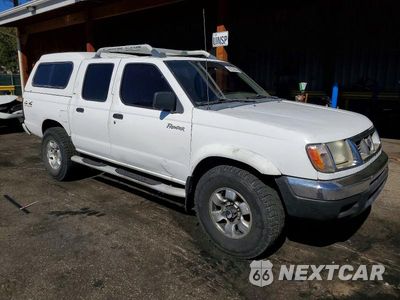 Czwarte zdjęcie samochodu z boku: 2000 NISSAN FRONTIER XE VIN:1N6ED27Y5YC379201 - miniatura