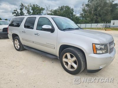 Czwarte zdjęcie samochodu z boku: 2014 CHEVROLET SUBURBAN C1500 LT VIN:1GNSCJE02ER219387 - miniatura