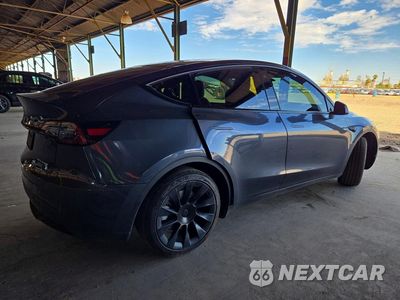 Trzecie zdjęcie samochodu z tyłu: 2023 TESLA MODEL Y VIN:7SAYGAEE2PF704157 - miniatura