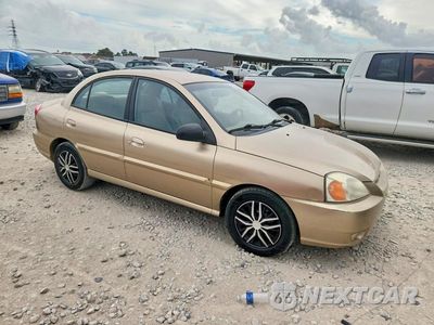 Czwarte zdjęcie samochodu z boku: 2004 KIA RIO BASE VIN:KNADC125746307818 - miniatura