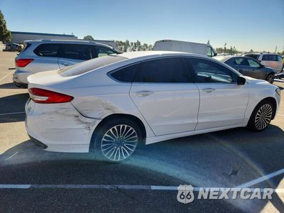 Trzecie zdjęcie samochodu z tyłu: 2017 FORD FUSION SE VIN:3FA6P0H94HR112584 - miniatura
