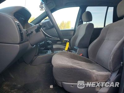 Zdjęcie 7 z 13 samochodu: 1999 JEEP GRAND CHEROKEE LAREDO VIN:1J4GW58S3XC609781 - miniatura