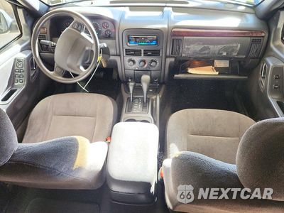 Zdjęcie 8 z 13 samochodu: 2000 JEEP GRAND CHEROKEE LAREDO VIN:1J4GW48S9YC239562 - miniatura