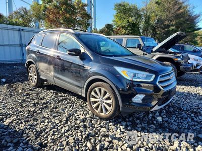 Czwarte zdjęcie samochodu z boku: 2017 FORD ESCAPE TITANIUM VIN:1FMCU9JD4HUB34128 - miniatura