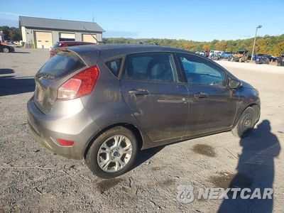 Trzecie zdjęcie samochodu z tyłu: 2014 FORD FIESTA SE VIN:3FADP4EJ2EM121385 - miniatura