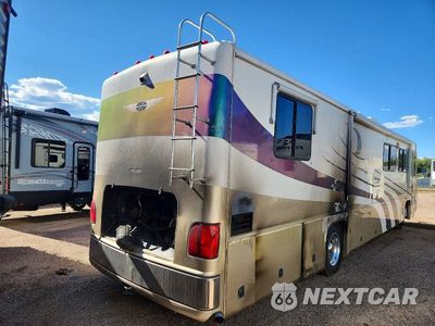 Czwarte zdjęcie samochodu z boku: 2001 FREIGHTLINER CHASSIS VCL VIN:4UZAAKA841CJ13818 - miniatura