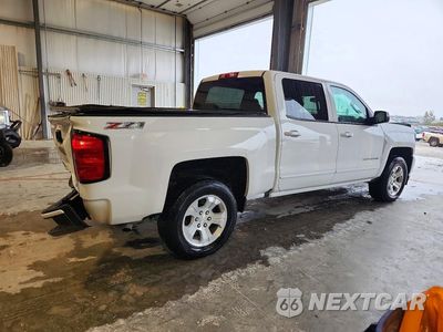 Trzecie zdjęcie samochodu z tyłu: 2017 CHEVROLET SILVERADO K1500 LT VIN:3GCUKREC9HG236012 - miniatura