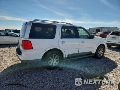 Trzecie zdjęcie samochodu z tyłu: 2003 LINCOLN NAVIGATOR VIN:5LMFU27R53LJ47165 - miniatura