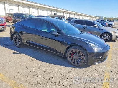 Czwarte zdjęcie samochodu z boku: 2023 TESLA MODEL 3 VIN:5YJ3E1EC2PF671981 - miniatura