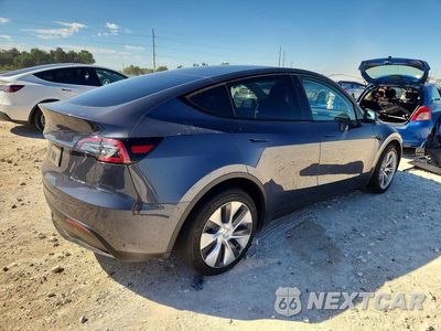 Trzecie zdjęcie samochodu z tyłu: 2023 TESLA MODEL Y VIN:7SAYGDEE4PA106702 - miniatura