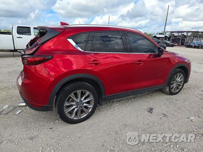 Trzecie zdjęcie samochodu z tyłu: 2021 MAZDA CX-5 GRAND TOURING VIN:JM3KFBDM5M1441419 - miniatura