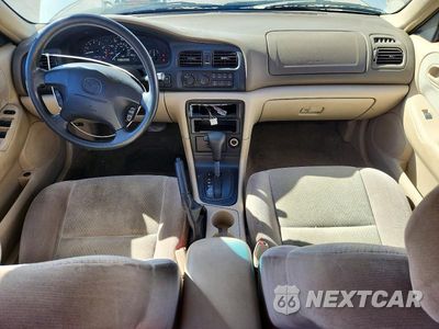 Zdjęcie 8 z 13 samochodu: 1998 MAZDA 626 DX VIN:1YVGF22C4W5735957 - miniatura