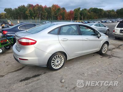 Trzecie zdjęcie samochodu z tyłu: 2014 FORD FIESTA TITANIUM VIN:3FADP4CJ3EM194879 - miniatura