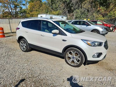 Czwarte zdjęcie samochodu z boku: 2017 FORD ESCAPE TITANIUM VIN:1FMCU0JD0HUE67521 - miniatura