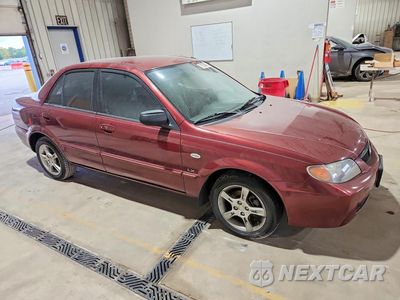 Czwarte zdjęcie samochodu z boku: 2003 MAZDA PROTEGE DX VIN:JM1BJ225330156922 - miniatura