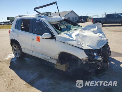 Czwarte zdjęcie samochodu z boku: 2014 VOLKSWAGEN TIGUAN S VIN:WVGAV3AX7EW021916 - miniatura