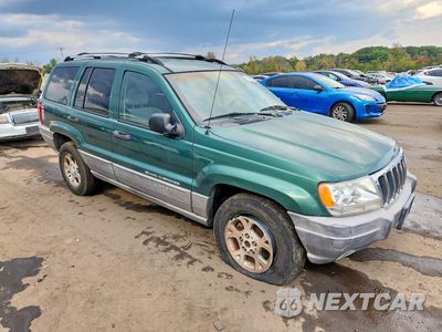 Czwarte zdjęcie samochodu z boku: 1999 JEEP GRAND CHEROKEE LAREDO VIN:1J4GW58S1XC680154 - miniatura