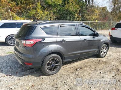 Trzecie zdjęcie samochodu z tyłu: 2018 FORD ESCAPE SE VIN:1FMCU9GD0JUB81024 - miniatura
