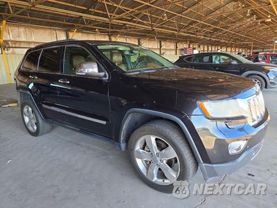 Czwarte zdjęcie samochodu z boku: 2013 JEEP GRAND CHEROKEE OVERLAND VIN:1C4RJECT8DC556519 - miniatura