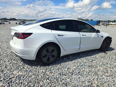 Trzecie zdjęcie samochodu z tyłu: 2023 TESLA MODEL 3 VIN:5YJ3E1EA7PF459804 - miniatura