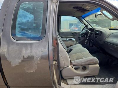 Zdjęcie 10 z 12 samochodu: 2003 FORD F150 XL VIN:1FTRX17293NB39650 - miniatura