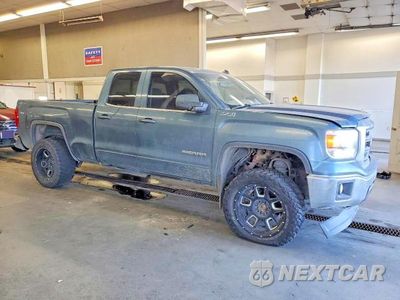 Czwarte zdjęcie samochodu z boku: 2014 GMC SIERRA K1500 SLE VIN:1GTV2UEC4EZ117853 - miniatura