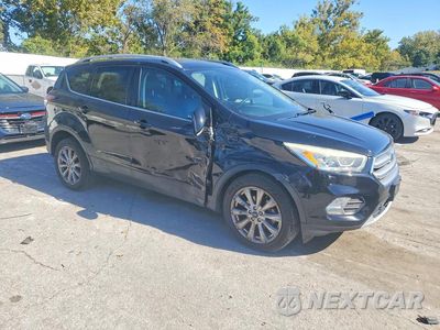 Czwarte zdjęcie samochodu z boku: 2017 FORD ESCAPE TITANIUM VIN:1FMCU0JD0HUE90880 - miniatura