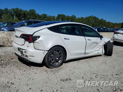 Trzecie zdjęcie samochodu z tyłu: 2021 TESLA MODEL 3 VIN:5YJ3E1EA2MF986497 - miniatura