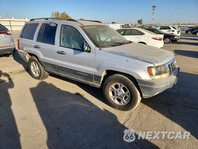 Czwarte zdjęcie samochodu z boku: 2003 JEEP GRAND CHEROKEE LAREDO VIN:1J4GX48S43C518665 - miniatura