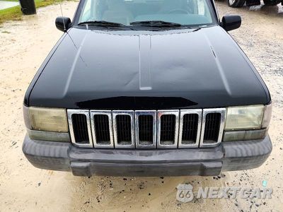 Zdjęcie 12 z 13 samochodu: 1997 JEEP GRAND CHEROKEE LAREDO VIN:1J4FX58S7VC724129 - miniatura