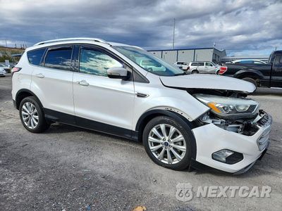 Czwarte zdjęcie samochodu z boku: 2017 FORD ESCAPE TITANIUM VIN:1FMCU0J93HUD54299 - miniatura