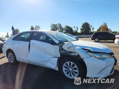Czwarte zdjęcie samochodu z boku: 2015 TOYOTA CAMRY HYBRID LE VIN:4T1BD1FK0FU149145 - miniatura