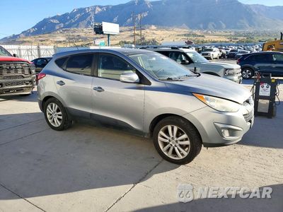 Czwarte zdjęcie samochodu z boku: 2010 HYUNDAI TUCSON LIMITED VIN:KM8JUCAC1AU034084 - miniatura