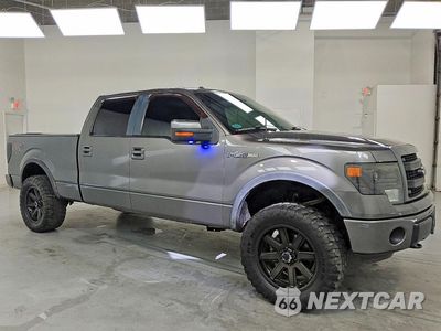 Czwarte zdjęcie samochodu z boku: 2014 FORD F150 SUPERCREW VIN:1FTFW1EF3EFA33834 - miniatura