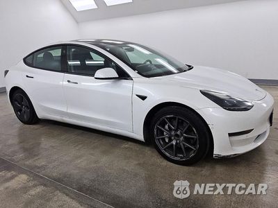 Czwarte zdjęcie samochodu z boku: 2022 TESLA MODEL 3 VIN:5YJ3E1EA7NF288078 - miniatura