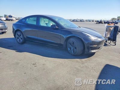 Czwarte zdjęcie samochodu z boku: 2023 TESLA MODEL 3 VIN:5YJ3E1EA5PF584932 - miniatura