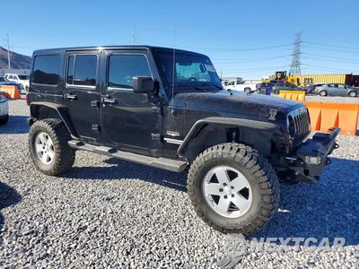 Czwarte zdjęcie samochodu z boku: 2012 JEEP WRANGLER UNLIMITED SAHARA VIN:1C4HJWEG3CL205744 - miniatura