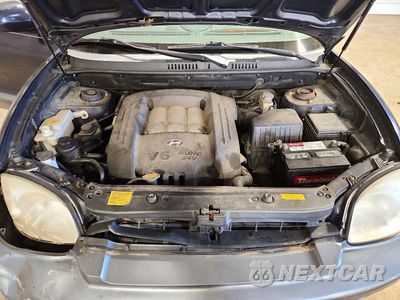 Zdjęcie 12 z 13 samochodu: 2005 HYUNDAI SANTA FE GLS VIN:KM8SC73D95U012957 - miniatura