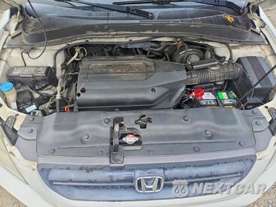 Zdjęcie 12 z 13 samochodu: 2004 HONDA PILOT EX VIN:2HKYF18404H608673 - miniatura