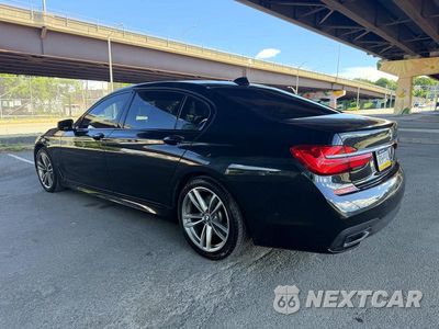 Trzecie zdjęcie samochodu z tyłu: 2019 BMW 750 XI VIN:WBA7F2C56K8240643 - miniatura