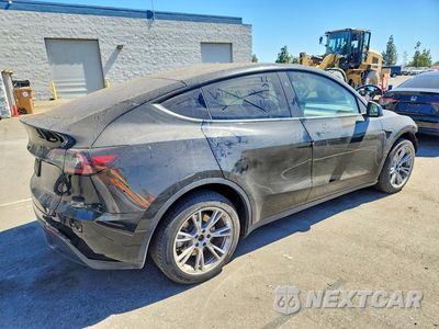 Trzecie zdjęcie samochodu z tyłu: 2023 TESLA MODEL Y VIN:7SAYGDEE0PA212869 - miniatura