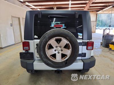 Zdjęcie 6 z 13 samochodu: 2010 JEEP WRANGLER UNLIMITED SAHARA VIN:1J4HA5H11AL221028 - miniatura
