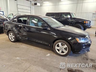 Czwarte zdjęcie samochodu z boku: 2017 VOLKSWAGEN JETTA S VIN:3VW2B7AJ2HM374764 - miniatura
