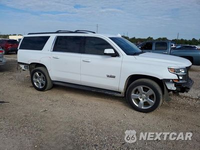 Czwarte zdjęcie samochodu z boku: 2019 CHEVROLET SUBURBAN C1500 LT VIN:1GNSCHKC4KR264172 - miniatura