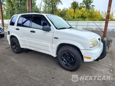 Czwarte zdjęcie samochodu z boku: 1999 SUZUKI GRAND VITARA JX VIN:JS3TD62V6X4110973 - miniatura