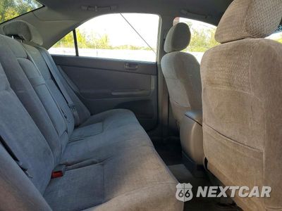 Zdjęcie 10 z 13 samochodu: 2003 TOYOTA CAMRY LE VIN:JTDBE32KX30173328 - miniatura