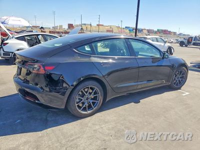 Trzecie zdjęcie samochodu z tyłu: 2023 TESLA MODEL 3 VIN:5YJ3E1EA2PF704184 - miniatura